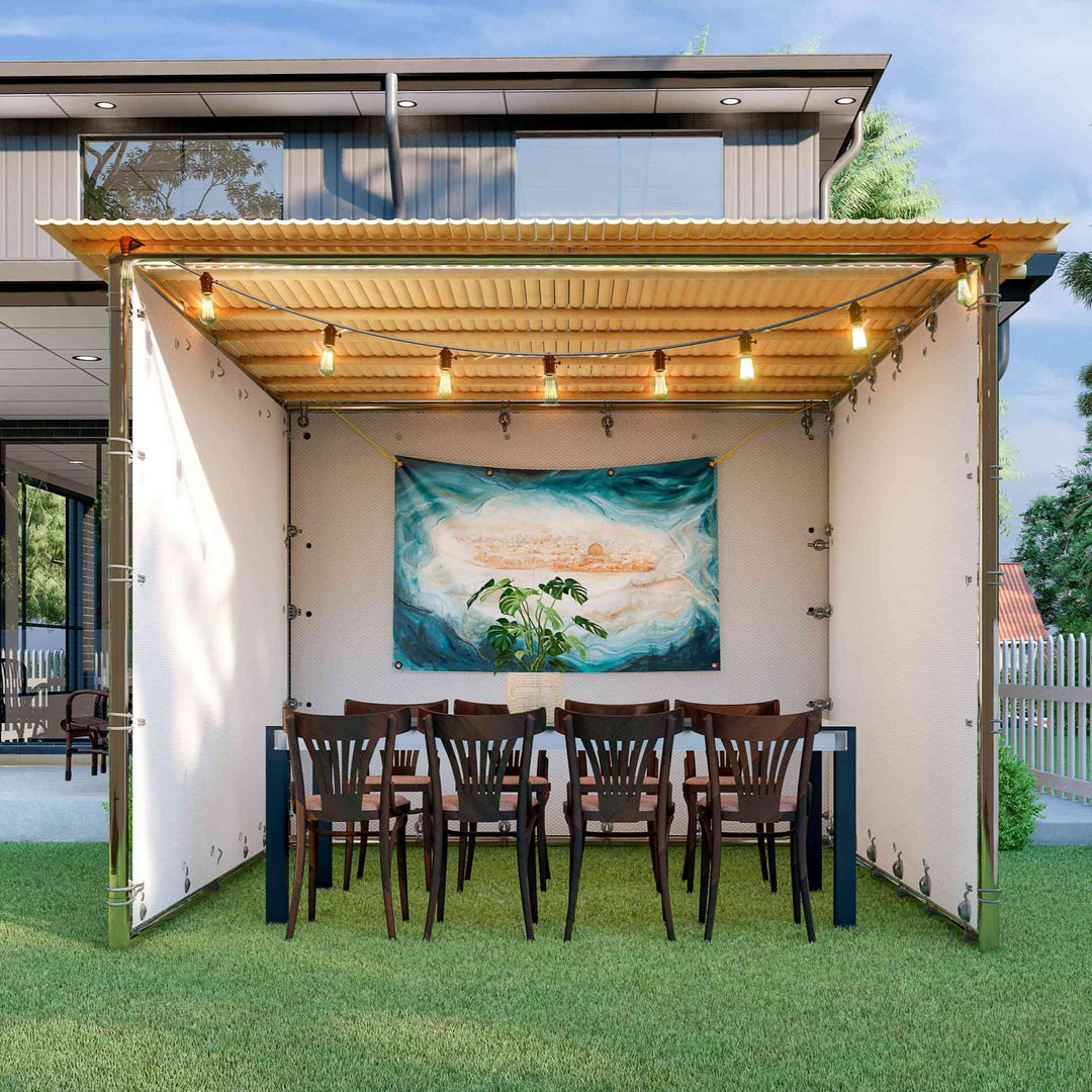 Easy to build Sieger Sukkah kit with kosher bamboo Schach mats, set table and chairs and a decorative Sukkah tapestry